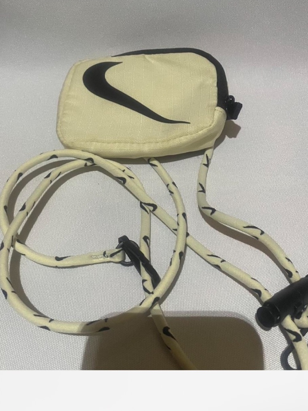 Nike Pale Yellow Mini Crossbody Pouch with Black Swoosh